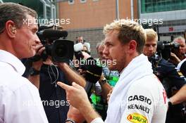 (L to R): David Coulthard (GBR) Red Bull Racing and Scuderia Toro Advisor / BBC Television Commentator with Sebastian Vettel (GER) Red Bull Racing on the grid. 06.10.2013. Formula 1 World Championship, Rd 14, Korean Grand Prix, Yeongam, South Korea, Race Day.