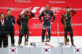 The podium (L to R): Kimi Raikkonen (FIN) Lotus F1 Team, second; Sebastian Vettel (GER) Red Bull Racing, race winner; Romain Grosjean (FRA) Lotus F1 Team, third. 06.10.2013. Formula 1 World Championship, Rd 14, Korean Grand Prix, Yeongam, South Korea, Race Day.