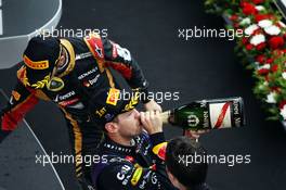 Race winner Sebastian Vettel (GER) Red Bull Racing celebrates on the podium with third placed Romain Grosjean (FRA) Lotus F1 Team. 06.10.2013. Formula 1 World Championship, Rd 14, Korean Grand Prix, Yeongam, South Korea, Race Day.