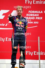 Race winner Sebastian Vettel (GER) Red Bull Racing celebrates on the podium. 06.10.2013. Formula 1 World Championship, Rd 14, Korean Grand Prix, Yeongam, South Korea, Race Day.