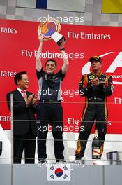 Tim Malyon (GBR) Red Bull Racing Performance Engineer celebrates on the podium. 06.10.2013. Formula 1 World Championship, Rd 14, Korean Grand Prix, Yeongam, South Korea, Race Day.