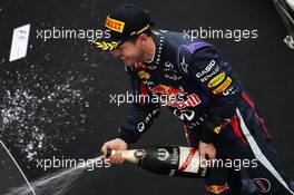 Race winner Sebastian Vettel (GER) Red Bull Racing celebrates on the podium. 06.10.2013. Formula 1 World Championship, Rd 14, Korean Grand Prix, Yeongam, South Korea, Race Day.