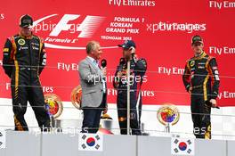 The podium (L to R): Kimi Raikkonen (FIN) Lotus F1 Team, second; Johnny Herbert (GBR); Sebastian Vettel (GER) Red Bull Racing, race winner; Romain Grosjean (FRA) Lotus F1 Team, third. 06.10.2013. Formula 1 World Championship, Rd 14, Korean Grand Prix, Yeongam, South Korea, Race Day.