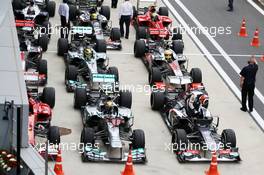 Lewis Hamilton (GBR) Mercedes AMG F1 W04 and Nico Hulkenberg (GER) Sauber C32 head the field in parc ferme. 06.10.2013. Formula 1 World Championship, Rd 14, Korean Grand Prix, Yeongam, South Korea, Race Day.