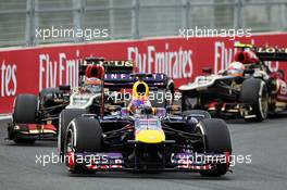 Sebastian Vettel (GER) Red Bull Racing RB9 leads Kimi Raikkonen (FIN) Lotus F1 E21. 06.10.2013. Formula 1 World Championship, Rd 14, Korean Grand Prix, Yeongam, South Korea, Race Day.