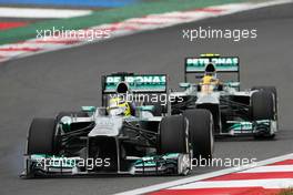 Nico Rosberg (GER) Mercedes AMG F1 W04 with a loose front wing, leads team mate Lewis Hamilton (GBR) Mercedes AMG F1 W04. 06.10.2013. Formula 1 World Championship, Rd 14, Korean Grand Prix, Yeongam, South Korea, Race Day.