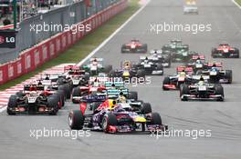 Sebastian Vettel (GER) Red Bull Racing RB9 leads at the start of the race. 06.10.2013. Formula 1 World Championship, Rd 14, Korean Grand Prix, Yeongam, South Korea, Race Day.