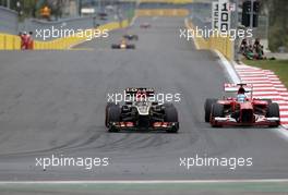 Kimi Raikkonen (FIN), Lotus F1 Team and Fernando Alonso (ESP), Scuderia Ferrari  06.10.2013. Formula 1 World Championship, Rd 14, Korean Grand Prix, Yeongam, South Korea, Race Day.