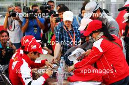 Felipe Massa (BRA) Ferrari and team mate Fernando Alonso (ESP) Ferrari sign autographs for the fans. 05.10.2013. Formula 1 World Championship, Rd 14, Korean Grand Prix, Yeongam, South Korea, Qualifying Day.