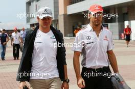 (L to R): Nico Rosberg (GER) Mercedes AMG F1 with Jenson Button (GBR) McLaren on the drivers parade. 06.10.2013. Formula 1 World Championship, Rd 14, Korean Grand Prix, Yeongam, South Korea, Race Day.