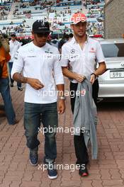 (L to R): Lewis Hamilton (GBR) Mercedes AMG F1 and Jenson Button (GBR) McLaren on the drivers parade. 06.10.2013. Formula 1 World Championship, Rd 14, Korean Grand Prix, Yeongam, South Korea, Race Day.