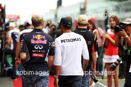 (L to R): Sebastian Vettel (GER) Red Bull Racing and Lewis Hamilton (GBR) Mercedes AMG F1 on the drivers parade. 06.10.2013. Formula 1 World Championship, Rd 14, Korean Grand Prix, Yeongam, South Korea, Race Day.