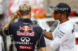 (L to R): Sebastian Vettel (GER) Red Bull Racing with Lewis Hamilton (GBR) Mercedes AMG F1 on the drivers parade. 06.10.2013. Formula 1 World Championship, Rd 14, Korean Grand Prix, Yeongam, South Korea, Race Day.