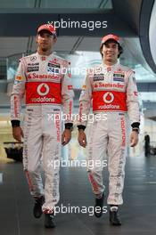 (L to R): Jenson Button (GBR) McLaren with team mate Sergio Perez (MEX) McLaren. 31.01.2013. McLaren MP4-28 Launch, McLaren Technology Centre, Woking, England.