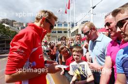 Max Chilton (GBR) Marussia F1 Team signs autographs for the fans. 24.05.2013. Formula 1 World Championship, Rd 6, Monaco Grand Prix, Monte Carlo, Monaco, Friday.