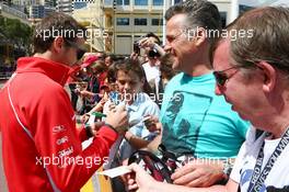 Jules Bianchi (FRA) Marussia F1 Team signs autographs for the fans. 24.05.2013. Formula 1 World Championship, Rd 6, Monaco Grand Prix, Monte Carlo, Monaco, Friday.