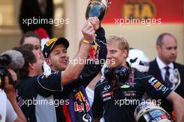 Sebastian Vettel (GER) Red Bull Racing celebrates his second position with Christian Horner (GBR) Red Bull Racing Team Principal on the podium. 26.05.2013. Formula 1 World Championship, Rd 6, Monaco Grand Prix, Monte Carlo, Monaco, Race Day.