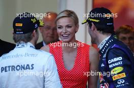 (L to R): Nico Rosberg (GER) Mercedes AMG F1 with Princess Charlene of Monaco (RSA)  and Mark Webber (AUS) Red Bull Racing on the podium. 26.05.2013. Formula 1 World Championship, Rd 6, Monaco Grand Prix, Monte Carlo, Monaco, Race Day.