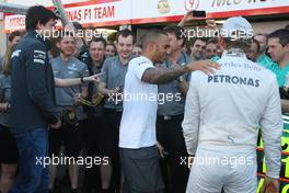 Race winner Nico Rosberg (GER) Mercedes AMG F1 celebrates with Lewis Hamilton (GBR) Mercedes AMG F1 and the team. 26.05.2013. Formula 1 World Championship, Rd 6, Monaco Grand Prix, Monte Carlo, Monaco, Race Day.