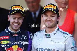 (L to R): Second placed Sebastian Vettel (GER) Red Bull Racing with race winner Nico Rosberg (GER) Mercedes AMG F1. 26.05.2013. Formula 1 World Championship, Rd 6, Monaco Grand Prix, Monte Carlo, Monaco, Race Day.