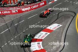 Jules Bianchi (FRA) Marussia F1 Team MR02 leads Giedo van der Garde (NLD) Caterham CT03. 26.05.2013. Formula 1 World Championship, Rd 6, Monaco Grand Prix, Monte Carlo, Monaco, Race Day.