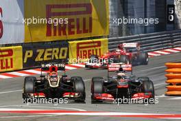Kimi Raikkonen (FIN) Lotus F1 E21 and Sergio Perez (MEX) McLaren MP4-28 battle for position. 26.05.2013. Formula 1 World Championship, Rd 6, Monaco Grand Prix, Monte Carlo, Monaco, Race Day.