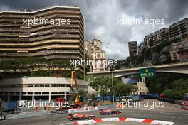 Mark Webber (AUS) Red Bull Racing RB9 and Max Chilton (GBR) Marussia F1 Team MR02. 25.05.2013. Formula 1 World Championship, Rd 6, Monaco Grand Prix, Monte Carlo, Monaco, Qualifying Day