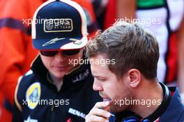 (L to R): Kimi Raikkonen (FIN) Lotus F1 Team with Sebastian Vettel (GER) Red Bull Racing on the drivers parade. 26.05.2013. Formula 1 World Championship, Rd 6, Monaco Grand Prix, Monte Carlo, Monaco, Race Day.