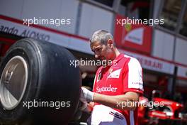 Ferrari mechanic with a Pirelli tyre. 22.05.2013. Formula 1 World Championship, Rd 6, Monaco Grand Prix, Monte Carlo, Monaco, Preparation Day.