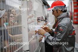 Sergio Perez (MEX) McLaren signs autographs for the fans. 22.05.2013. Formula 1 World Championship, Rd 6, Monaco Grand Prix, Monte Carlo, Monaco, Preparation Day.