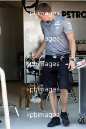Roscoe, the dog owned by Lewis Hamilton (GBR) Mercedes AMG F1, with a Mercedes AMG F1 mechanic. 22.05.2013. Formula 1 World Championship, Rd 6, Monaco Grand Prix, Monte Carlo, Monaco, Preparation Day.