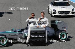 (L to R): Lewis Hamilton (GBR) Mercedes AMG F1 and team mate Nico Rosberg (GER) Mercedes AMG F1 with the new Mercedes AMG F1 W04 and promote new Blackberry sponsorship for the team. 04.02.2013. Mercedes AMG F1 W04 Launch, Jerez, Spain.