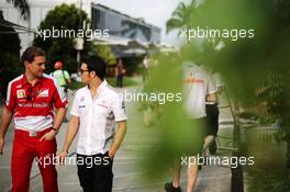 (L to R): Renato Bisignani (ITA) Ferrari Head of Communications with Sergio Perez (MEX) McLaren. 22.03.2013. Formula 1 World Championship, Rd 2, Malaysian Grand Prix, Sepang, Malaysia, Friday.