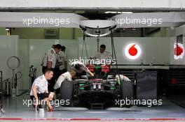 McLaren MP4-28 is prepared in the pits. 22.03.2013. Formula 1 World Championship, Rd 2, Malaysian Grand Prix, Sepang, Malaysia, Friday.