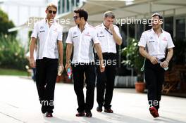 (L to R): Jenson Button (GBR) McLaren with team mate Sergio Perez (MEX) McLaren and Gary Paffett (GBR) McLaren Test Driver. 22.03.2013. Formula 1 World Championship, Rd 2, Malaysian Grand Prix, Sepang, Malaysia, Friday.
