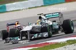 Lewis Hamilton (GBR) Mercedes AMG F1 W04 leads Sebastian Vettel (GER) Red Bull Racing RB9. 22.03.2013. Formula 1 World Championship, Rd 2, Malaysian Grand Prix, Sepang, Malaysia, Friday.