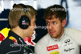 Sebastian Vettel (GER) Red Bull Racing with Heikki Huovinen (FIN) Personal Trainer. 22.03.2013. Formula 1 World Championship, Rd 2, Malaysian Grand Prix, Sepang, Malaysia, Friday.