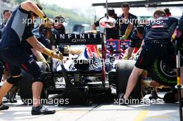 Sebastian Vettel (GER) Red Bull Racing RB9 practices a pit stop. 22.03.2013. Formula 1 World Championship, Rd 2, Malaysian Grand Prix, Sepang, Malaysia, Friday.