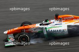 Paul di Resta (GBR) Sahara Force India VJM06 locks up under braking. 22.03.2013. Formula 1 World Championship, Rd 2, Malaysian Grand Prix, Sepang, Malaysia, Friday.