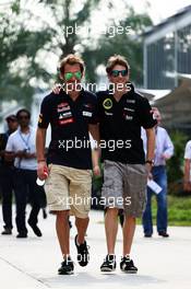 (L to R): Jean-Eric Vergne (FRA) Scuderia Toro Rosso with Romain Grosjean (FRA) Lotus F1 Team. 22.03.2013. Formula 1 World Championship, Rd 2, Malaysian Grand Prix, Sepang, Malaysia, Friday.