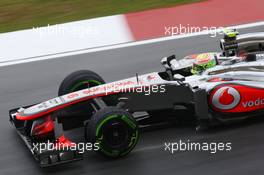 Sergio Perez (MEX) McLaren MP4-28 locks up under braking. 22.03.2013. Formula 1 World Championship, Rd 2, Malaysian Grand Prix, Sepang, Malaysia, Friday.