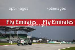 Giedo van der Garde (NLD) Caterham CT03 passes under Fly Emirates hoardings. 22.03.2013. Formula 1 World Championship, Rd 2, Malaysian Grand Prix, Sepang, Malaysia, Friday.