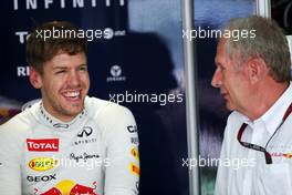 (L to R): Sebastian Vettel (GER) Red Bull Racing with Dr Helmut Marko (AUT) Red Bull Motorsport Consultant. 22.03.2013. Formula 1 World Championship, Rd 2, Malaysian Grand Prix, Sepang, Malaysia, Friday.