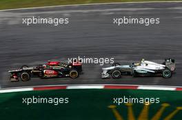 Kimi Raikkonen (FIN) Lotus F1 E21 leads Nico Rosberg (GER) Mercedes AMG F1 W04. 22.03.2013. Formula 1 World Championship, Rd 2, Malaysian Grand Prix, Sepang, Malaysia, Friday.