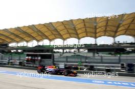 Sebastian Vettel (GER) Red Bull Racing RB9 leaves the pits. 22.03.2013. Formula 1 World Championship, Rd 2, Malaysian Grand Prix, Sepang, Malaysia, Friday.