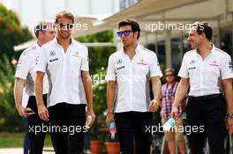 (L to R): Jenson Button (GBR) McLaren with Sergio Perez (MEX) McLaren and Gary Paffett (GBR) McLaren Test Driver. 22.03.2013. Formula 1 World Championship, Rd 2, Malaysian Grand Prix, Sepang, Malaysia, Friday.