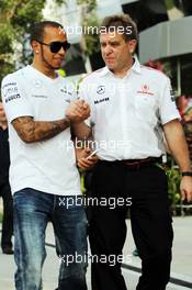 (L to R): Lewis Hamilton (GBR) Mercedes AMG F1 with Dr. Aki Hintsa (FIN) McLaren Team Doctor. 22.03.2013. Formula 1 World Championship, Rd 2, Malaysian Grand Prix, Sepang, Malaysia, Friday.