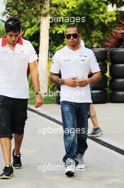 (L to R): Rodolfo Gonzalez (VEN) Marussia F1 Team Reserve Driver with Lewis Hamilton (GBR) Mercedes AMG F1. 22.03.2013. Formula 1 World Championship, Rd 2, Malaysian Grand Prix, Sepang, Malaysia, Friday.