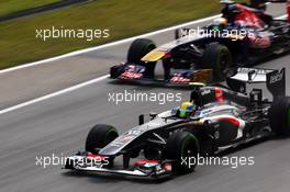 Esteban Gutierrez (MEX) Sauber C32 leads Jean-Eric Vergne (FRA) Scuderia Toro Rosso STR8. 22.03.2013. Formula 1 World Championship, Rd 2, Malaysian Grand Prix, Sepang, Malaysia, Friday.