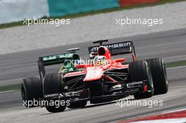 Jules Bianchi (FRA) Marussia F1 Team MR02 leads Giedo van der Garde (NLD) Caterham CT03.. 22.03.2013. Formula 1 World Championship, Rd 2, Malaysian Grand Prix, Sepang, Malaysia, Friday.